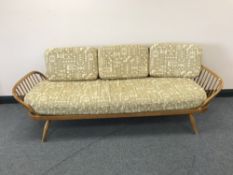 A mid 20th century Ercol elm framed settee /day bed