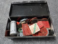 A metal box containing a quantity of vintage Meccano