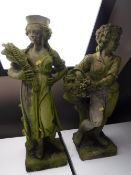 A pair of stone garden figures - Wheat gatherers