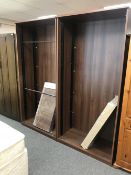 A pair of office bookcases in a dark wood finish