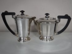 A silver teapot and coffee pot