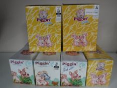 Ten boxed Piggin figures