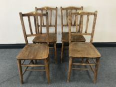 A set of four antique elm kitchen chairs