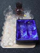 A tray of glass ware, two boxed pairs of crystal wine glasses, water jug,