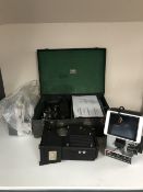 A cased vintage pathescope projector together with a cine camera other projectors and Elmo editor