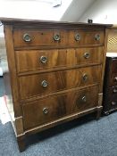 A Victorian inlaid mahogany five drawer chest labelled Hicks of Dublin