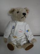 A Steiff light mohair bear - BMW bear, length 32 cm.