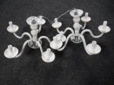 A pair of Italian glass five branch chandeliers