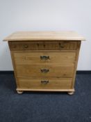 A continental pine four drawer chest