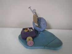 A Walt Disney Classic Collection Peter Pan Collector's Society display stand