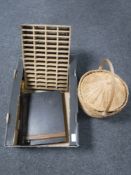 A box of guillotine, wicker storage basket,