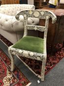 An Eastern carved chair with bone inlay, width 53 cm.