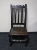 A 19th century oak hall chair
