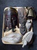 A tray of carved African mask, old wooden duck decoys,