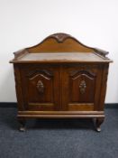 A continental oak double door sideboard with gallery