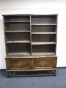 A set of oak open bookshelves fitted cupboard beneath CONDITION REPORT: 184cm high