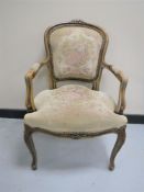 A French style armchair upholstered in a tapestry fabric
