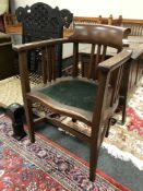 A 1920's oak office armchair,