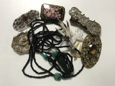 A long beaded necklace with jadeite pendant together with Victorian clip,