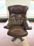 A brown leather swivel armchair