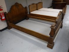 An early 20th century carved oak 4' bed frame