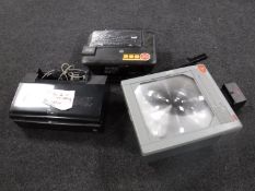 An overhead projector together with two printers