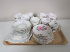 A tray of two tea services,