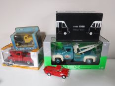 A group of five various die cast trucks and vans including 1:18 scale NEX Ford 1956 tow truck,