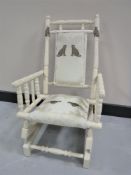 A painted child's rocking chair
