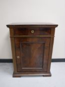A 19th century mahogany cabinet fitted a drawer