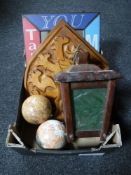 An old wooden lamp together with globe balls, carved plaques,