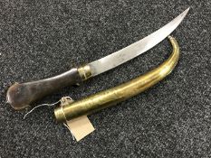 A Jambiya knife with curved blade in brass sheath