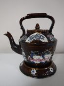 A nineteenth century Bargeware teapot on stand