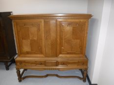 A continental light oak sideboard on stand
