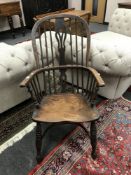 A 19th century elm Windsor chair, width 57 cm. CONDITION REPORT: Poor colour.