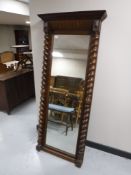 An antique oak dressing mirror with barley twist supports