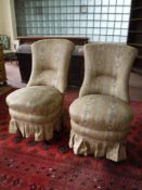 A pair of bedroom chairs in gold striped fabric
