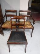 A pair of mahogany scroll armchairs and a dining chair