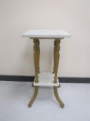 A gilt and marble two tier plant stand