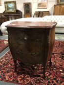 A walnut and marble topped bombe two drawer chest with ormolu mounts,