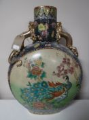 A Japanese moon flask decorated with peacocks
