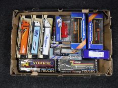 A box of various die cast trucks and super hauliers,
