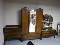 An oak three piece bedroom suite