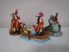 Three Disney showcase collection Peter Pan figures to include Captain Hook,