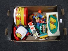 A box of vintage children's toys