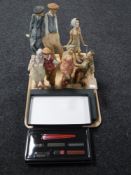 A tray of four Country Artists Views of Life figures together with two boxed Norman Rockwell from