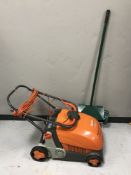 A Flymo lawn rake compact and a lawn Erator
