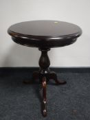 A Victorian style pedestal occasional table