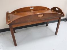 A mahogany butler's tray on stand