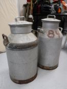 Two stainless steel milk churns
